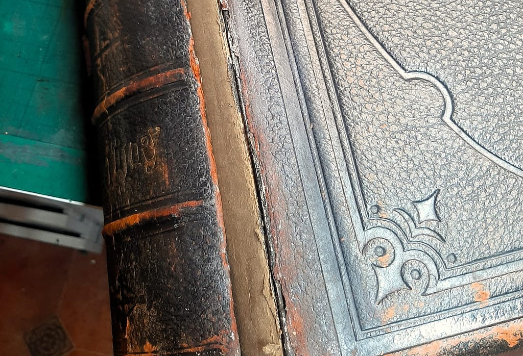 Family Bible after duct tape residue removal