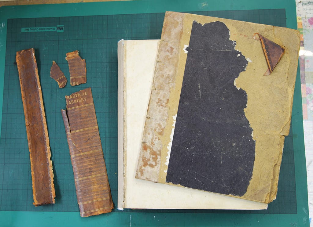 Antique book with detached boards and broken spine